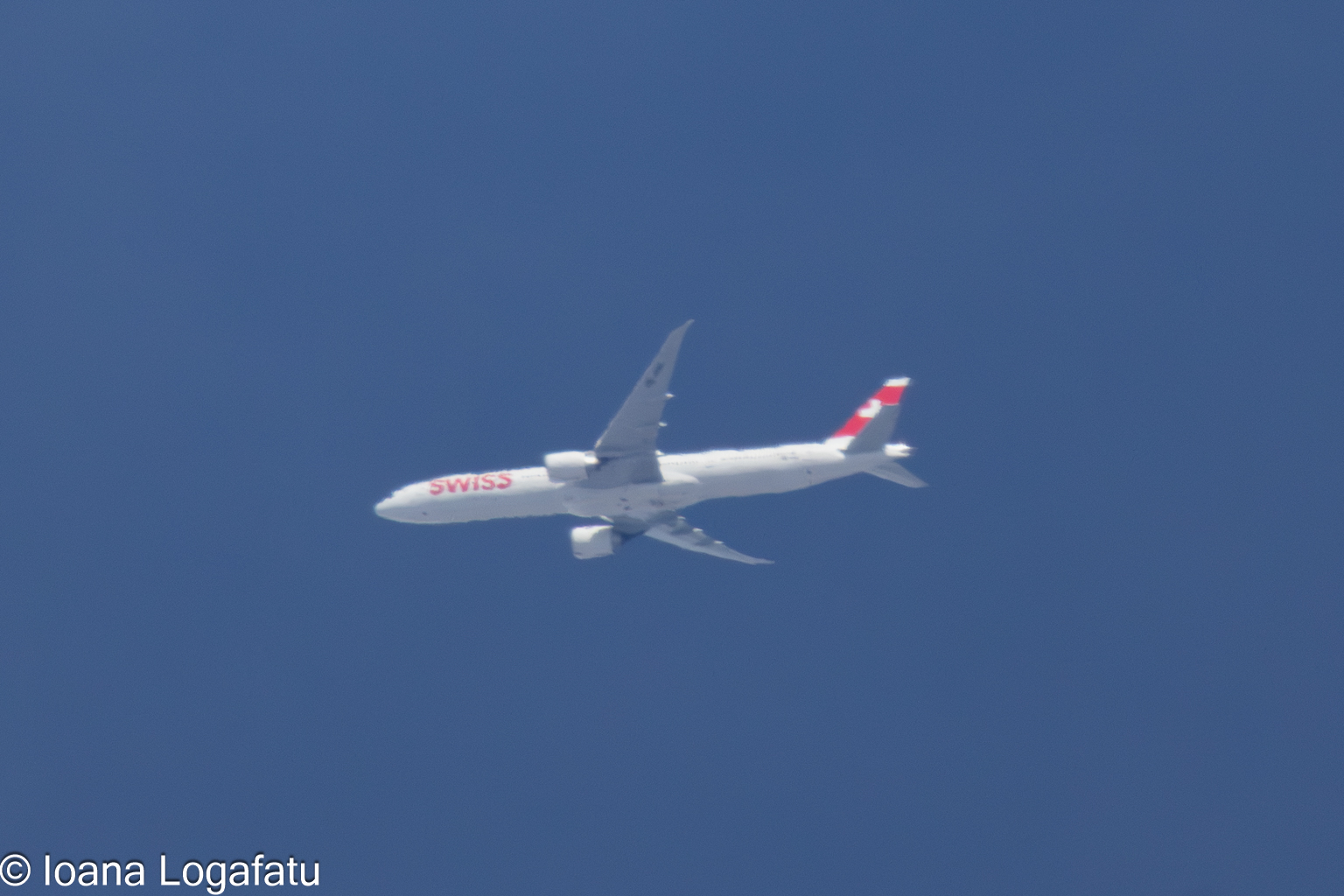 Flying high above the clouds at midday